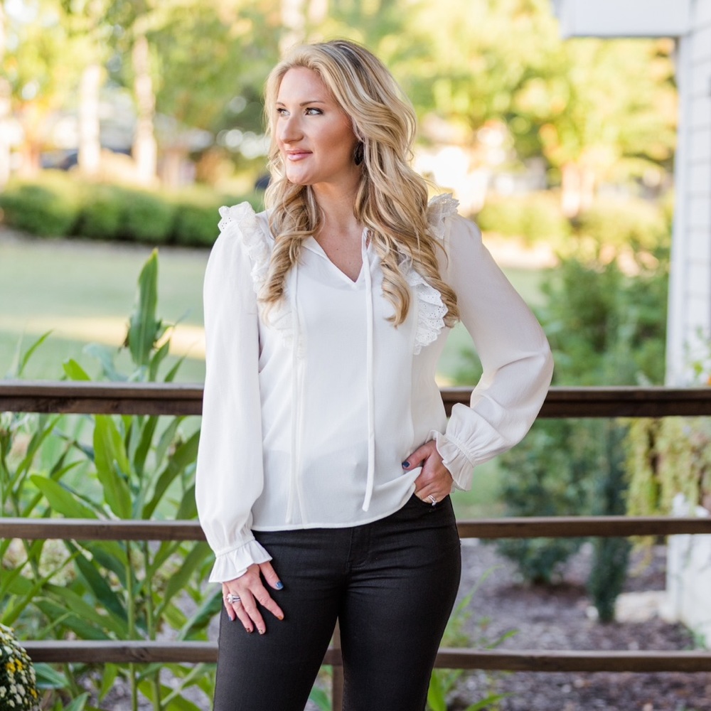 White blouse with ruffle shoulder